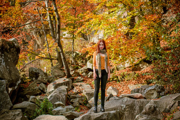 Woman in wild nature for blessing and enjoying nature greatness. Relaxation, meditation, harmony of inner life and mind. Unity of human and world. Exaltation of heart and consciousness.