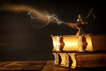 Image of magical aladdin lamp with glitter smoke. Lamp of wishes.