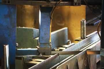 Automated saw cutting stainless steel