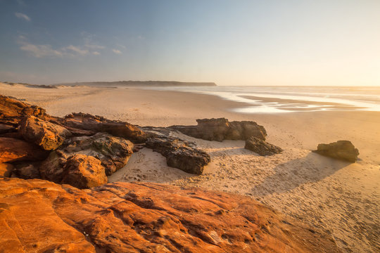 Praia da Bordeira, Algarve, Portugal. Red stone.