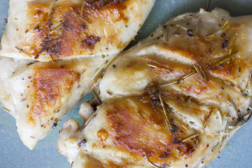 Chicken fillet laying around on a white background