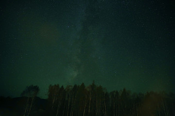 Night sky over rural landscape. Beautiful night starry sky