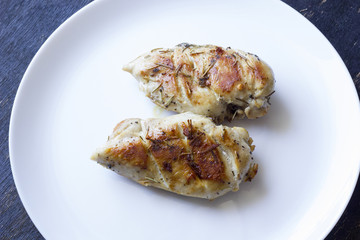 Chicken fillet laying around on a white background