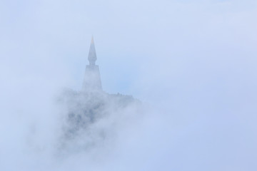 Amazing view of Pagoda on top of mountain with the mist and color full villa at Phu Tub Berk, Thailand