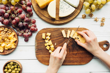 woman cutting cheese