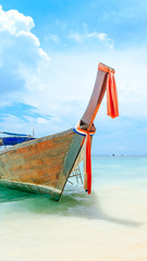Fototapeta premium Longtale boat on the white beach at Phuket, Thailand. Phuket is a popular destination famous for its beaches.