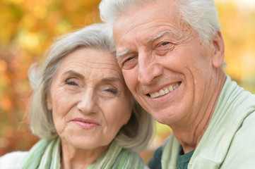 Senior couple in autumn park