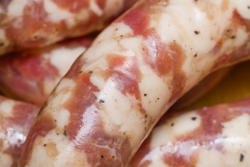 Raw handmade sausages. Selective focus, closeup.