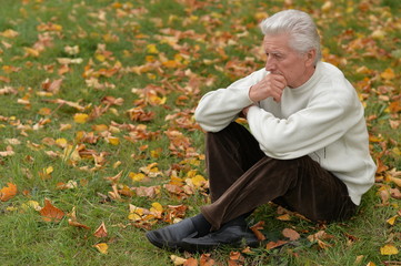 thoughtful senior man  in  park