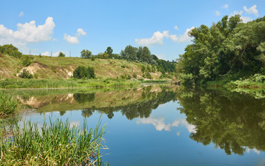 Fototapeta premium River with reflection of the sky