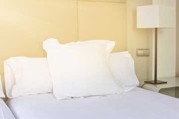 Fototapeta na wymiar Prepared fresh bed, scene in hotel room