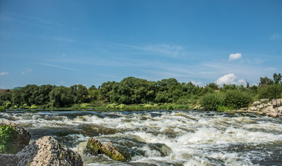 A rusty river on a sunny day.