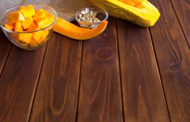 Preparing the pumpkin porridge on a dark wooden background