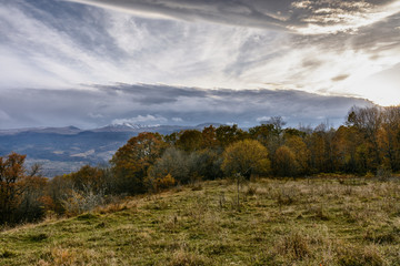 Mountain plateau and a beautiful view of the snow-capped mountains in autumn in the Krasnodar Territory, Russia