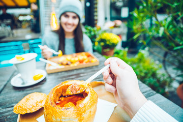 couple eating in cafe outside