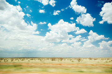 An empty Texas landscape viewed from highway speeds.