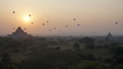 Sunrise as dozens of hot air balloons take off over Bagan, Myanmar.