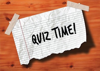 QUIZ TIME   handwritten on torn notebook page crumpled paper on wood texture background.