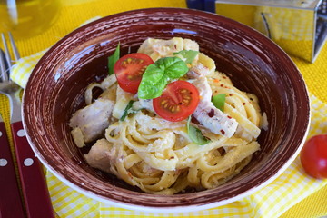 Pasta with chicken fillet, cream, onion.