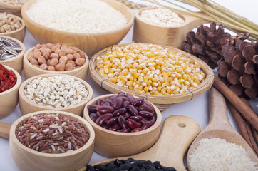 Cereal grains , seeds, beans on wooden background