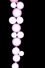 Isolated picture of white round lamps on the black wall.