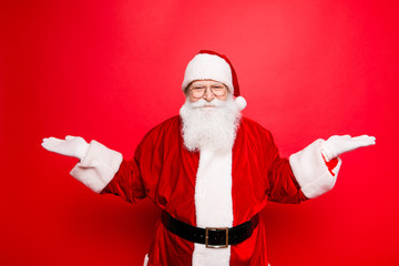 Fototapeta na wymiar Sales, marketing, discounts, advertising, presents, gifts, december, winter, wish, selling time! Santa is gesturing with hands like he is holding something and need to choose between two options