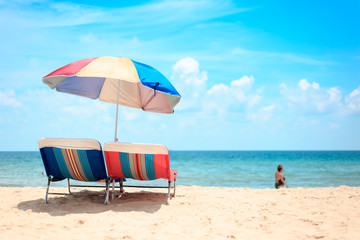 Ka-ron Beach at Phuket , Thailand. White sand beach with beach umbrella. Summer, Travel, Vacation and Holiday concept.