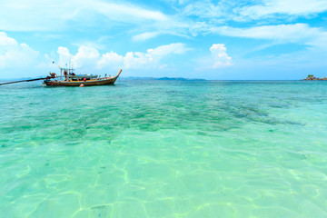 Obraz premium Longtail boats floating on the Sea at Phuket, Thailand. Summer, Travel, Vacation and Holiday concept.