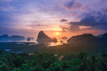 Naklejka na ściany i meble Landscape of sunrise at limestone karsts in Phang-nga bay at sunrise. Unseen place of 