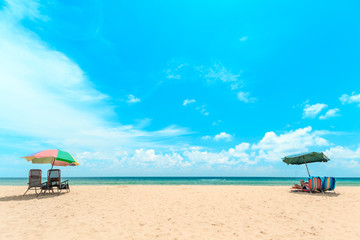 Obraz na płótnie Canvas Ka-ron Beach at Phuket , Thailand. White sand beach with beach umbrella. Summer, Travel, Vacation and Holiday concept.