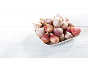 Fresh healthy garlic on white table