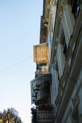  Buildings of an old European historic city hidden behind an afternoon shadow on a quiet summer day