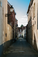 Residential street during late afternoon in Bruges, Belgium.