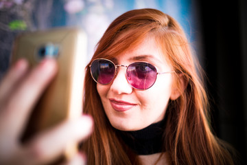 Beautiful girl drinking coffee at the coffee shop