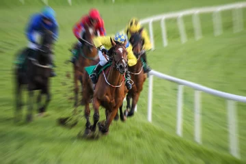 Papier Peint photo Lavable Léquitation Race horses and jockeys racing motion blur
