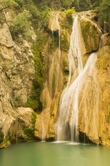 Fototapeta na wymiar Famous touristic destination Kadi waterfall in polilimnio Greece. 