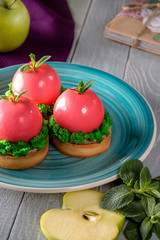 Cake covered with pink glaze. Luxury European dessert which look like an apple with green leaf