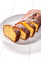 Yogurt citrus cake with powdered sugar on top