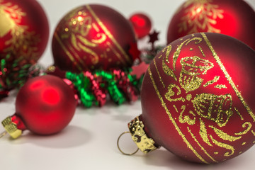 red christmas baubles with gold glitter