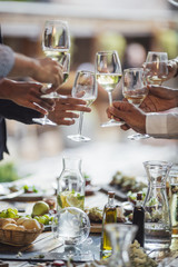 Friends Cheering With White Wine