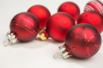 various red christmas baubles with glitter