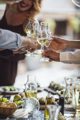 Friends Cheering With White Wine