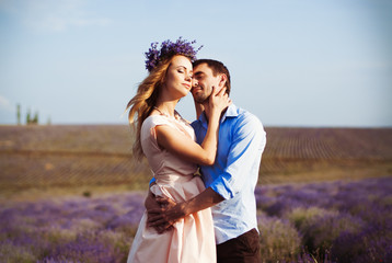 wedding in the lavender field in Provence. lovers embrace in a lavender field