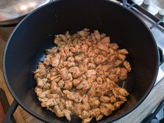 Roasting of chicken meat in frying pan / Fried sliced chicken or turkey fillet meat 