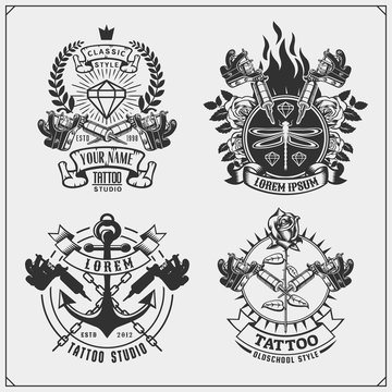 Vector set of tattoo salon labels, badges and design elements. Tattoo studio emblems with professional equipment, diamond and anchor.