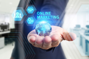 The concept of business, technology, the Internet and the network. A young entrepreneur working on a virtual screen of the future and sees the inscription: Online marketing