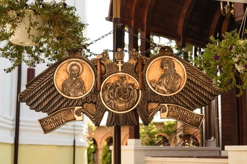 semantron hanging at Plumbuita monastery in Bucharest, Romania. Religious carved metal bronze plate.