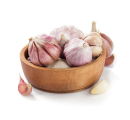 garlic in bowl isolated on white