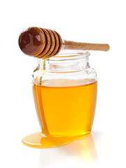 jar of honey on white background