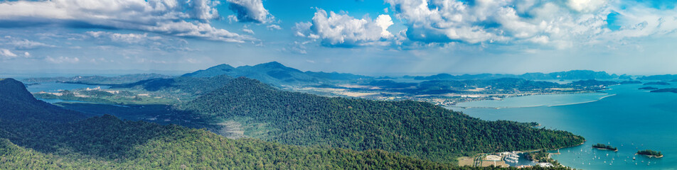 Panoramic view of blue sky, sea and mountain seen from Cable Car viewpoint, Langkawi, Malaysia. Picturesque landscape with tropical forest, beaches, small Islands in waters of Strait of Malacca